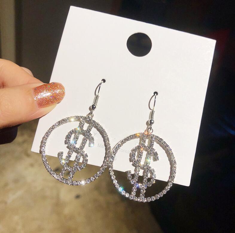 Dollar sign earrings