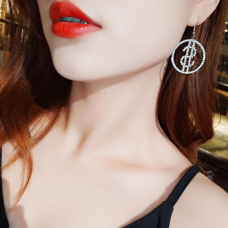 Dollar sign earrings